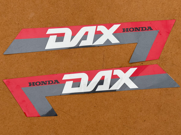 NOS Honda Silver/Red Frame Stickers (Pair) suitable for use with Dax 12V